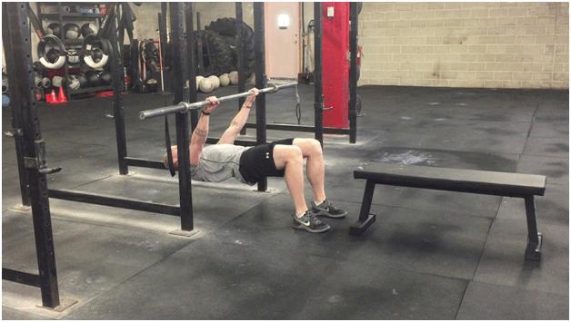 Performing Bent Knee Inverted Row Exercise