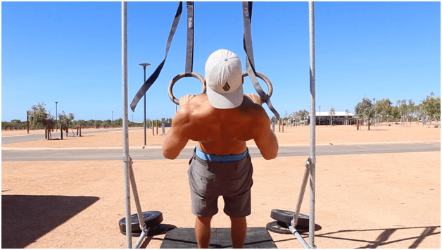 Performing Rope Pull-ups.